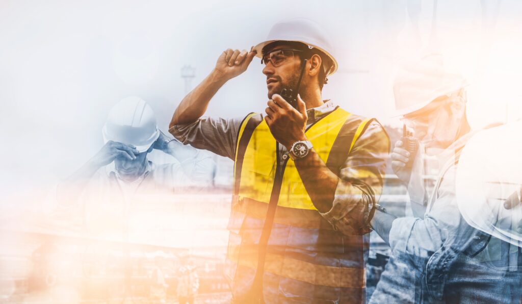 Double exposure of engineer man talking at a work site