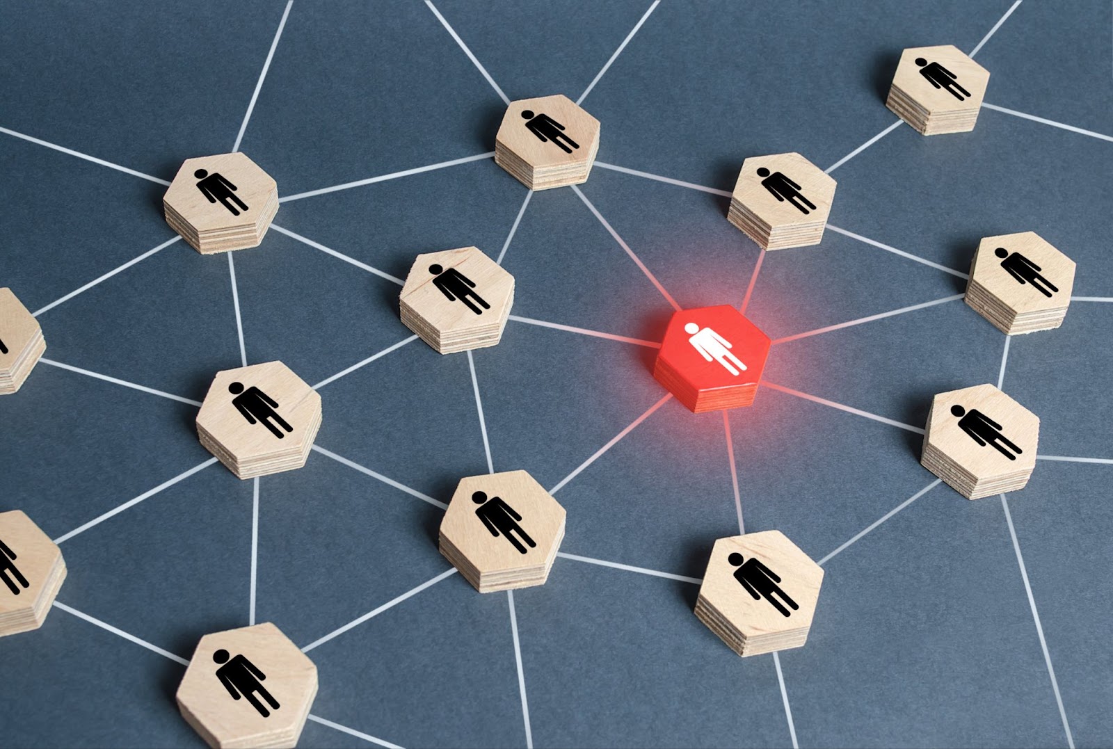 security threat highlighted as a red human figure in a wooden block network