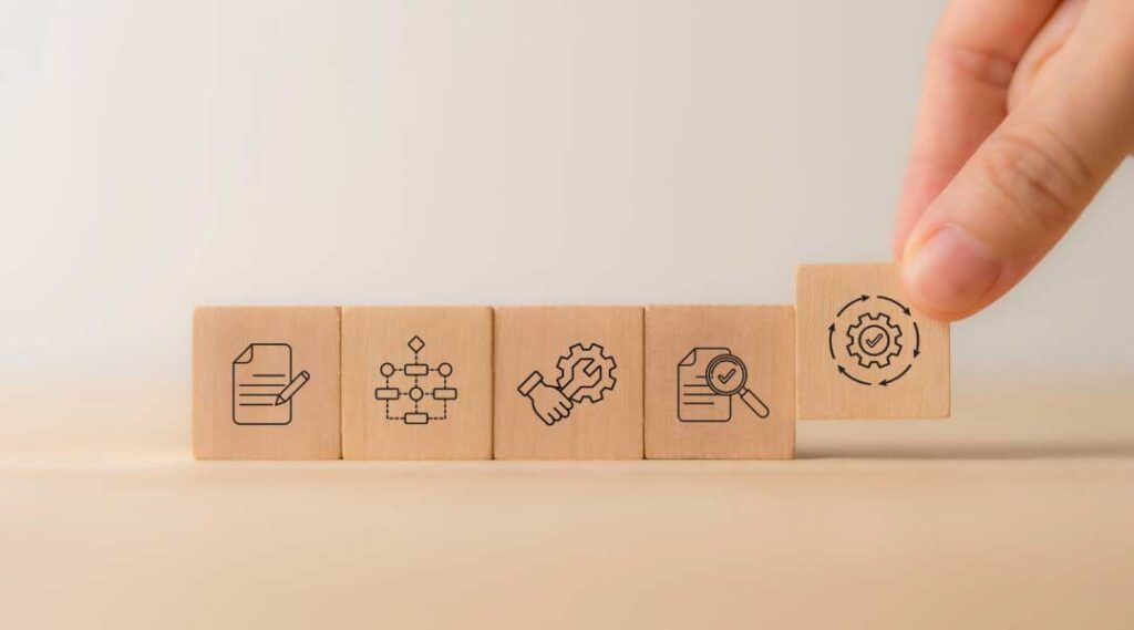 Wooden blocks with Managed Services icons for businesses to optimize operations, streamline processes, improve efficiency, and reduce costs.